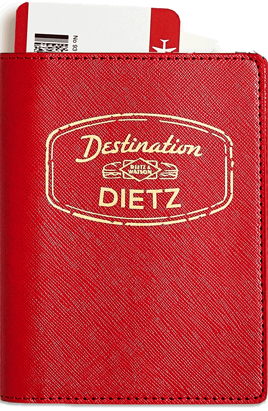 A red Destination Dietz passport book.